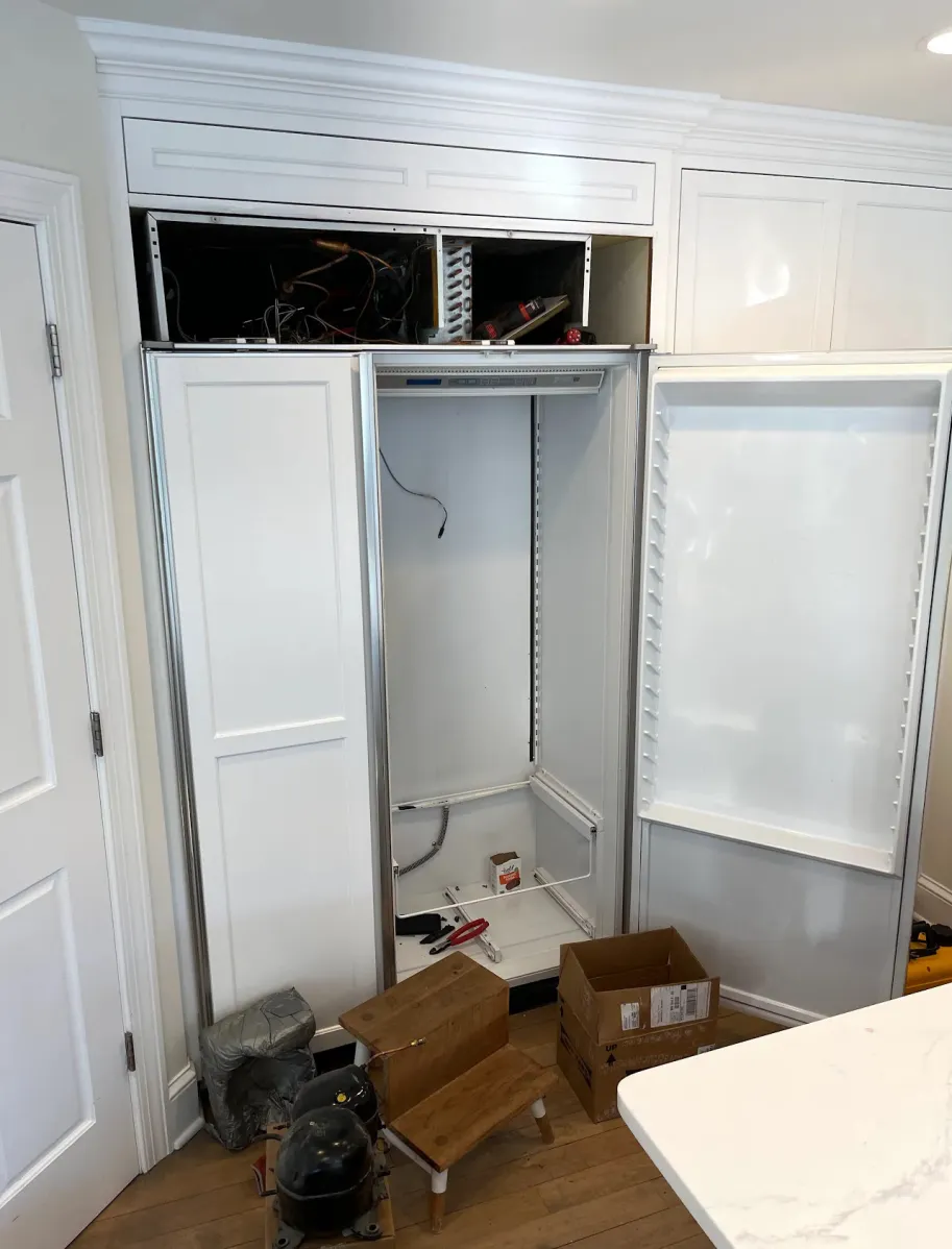 Sub-Zero 600 series built-in column open for authorized sealed-system service in a Twin Cities, MN kitchen
